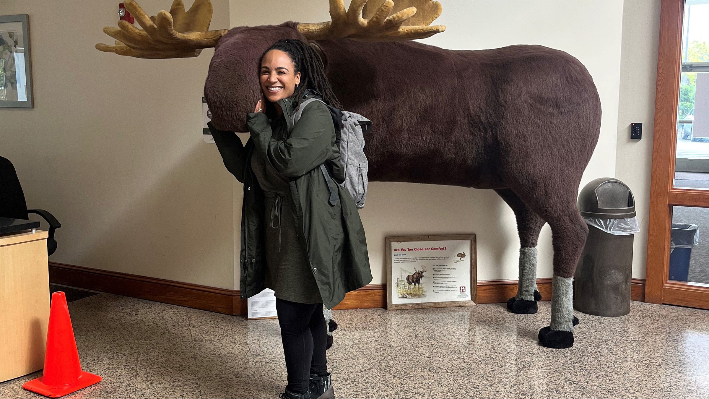TAC Senior Associate Alison Korte pets stuffed moose in New Hampshire.